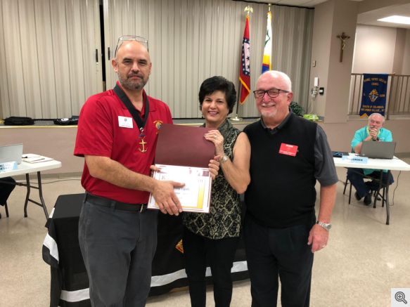 Jim and Pookie Dixon Receiving the Family of the Month Award from GK Rich Rivera